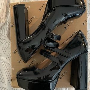 New with box black patent pump with double Mary Jane Velcro straps.